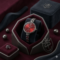 Sliver watch with red dial
